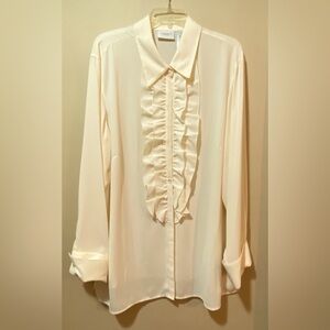 Women’s cream blouse with ruffled front.